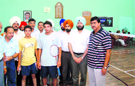 DC Deepinder Singh poses with players during the inauguration of the Punjab State Junior Badminton Championship in Patiala on Friday.