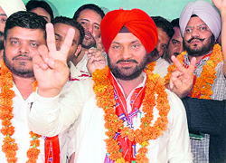 Darshan Singh with victory sign in Chandigarh on Friday.
