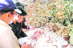 WTI, PFA and Forest Department officials seize sea shells at a shop in Haridwar.