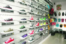 Sneakers and flip-flops at display at a showroom in Dehradun.
