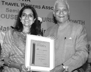 Kiran Choudhry receives Best Tourism Minister Award in New Delhi on Friday.