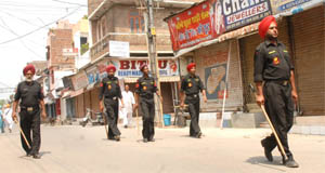 Police commandos patrol the streets in Jalandhar cantonment on Friday. 