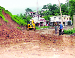 With the onset of the monsoon, the under-construction road from Basolhi to Bani has turned muddy.