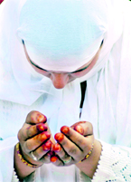 A woman offers namaz in the holy month of Ramzan in Jammu.