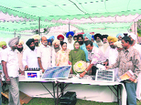 PEDA district manager Suresh Kumar Goel at a solar energy exhibition in Amloh on Friday.