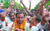 BJP candidate from Mayur Vihar Davender Kumar celebrates his victory