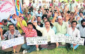 SRTC employees hold a protest at Bikram Chowk in Jammu