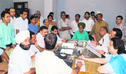 Additional Sessions Judge MS Virdi hears litigants during a lok adalat held at district court complex in Ludhiana on Saturday. 