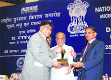 City-based industrialist Ramesh Mago receives national award for outstanding entrepreneurship from Union Minister Dinsha Patel at New Delhi.
