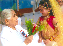 Dadi Janaki, the chief administrator of Brahmakumaris organisation, blesses Shraddha by offering her a bouquet during a function.