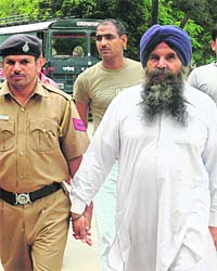 Pardeep Roy, follower of Baba Pritpal Singh, being produced at a court in Chandigarh