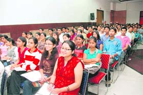 Students attend a seminar on CAT 2010 in Dehradun