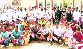 Students pose for a photograph after sports day at Chakar village .