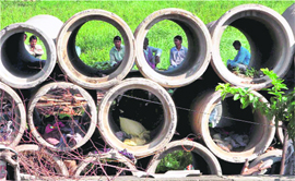 Unemployed workers wait at a construction site in New Delhi on Sunday