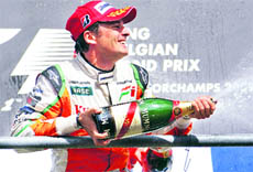 Force Indias Formula One driver Giancarlo Fisichella celebrates his second position at the Belgian Grand Prix in Spa Francorchamps on Sunday.