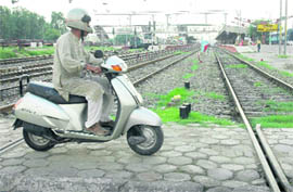 A path meant for the physically challenged being used by a scooterist at Chandigarh railway station.