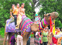 kids enjoy a camel ride