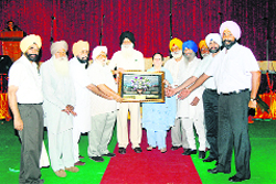 Ajmer Singh Lakhowal, chairman, Mandikaran Board, being honoured