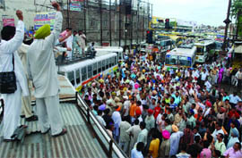PRTC employees hold a protest and block traffic outside the main bus stand in Bathinda on Tuesday. 