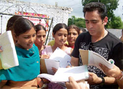 Students seeking autograph from Sarabjit Cheema, a renowned Punjabi singer-turned-actor, at the Swami Vivekanand College of Education in Bathinda on Tuesday. Cheema was in the city to promote his new film Apni Boli Apna Desh. He also visited the Pukhraj cinema. Cheema said his aim of acting in films was to promote Punjabi culture abroad.