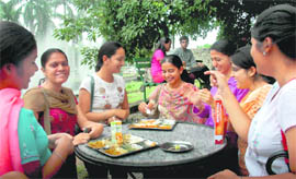 MCA girls enjoy food with the election gossips at Student Centre, Panjab University, in Chandigarh.
