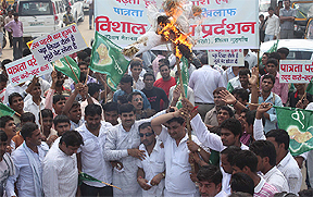 Activists of the Indian National Lok Dal (INLD) burn an effigy of Haryana Chief Minister Bhupender Singh Hooda in Gurgaon on Tuesday.