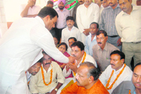 Leader of Opposition in Uttarkhand Assembly Harak Singh Rawat offers juice to Congress councillors at Dehradun Municipal Corporation on Tuesday