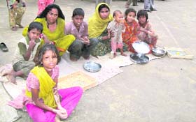 Beggars take position in front of Guga Mari, a day before the commencement of Chhapar Mela