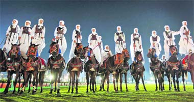 Horsemen display their skills at a dance spectacle organised for African heads of state by Libyan leader Muammar Gaddafi for celebrating the 40th anniversary of the 1969 military coup that brought him to power, at a military airfield outside Tripoli, Libya
