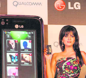 A model poses with LG smartphone GM 730-3G at its launch in New Delhi on Wednesday. It is priced at Rs 24,000 and is based on Qualcomm's chipset and Windows mobile and features touch screen that offers faster email setup and download. 