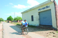 The locked gym at Kotdharmu village in Mansa district from where the police had found a cavity, allegedly to store weapons. 