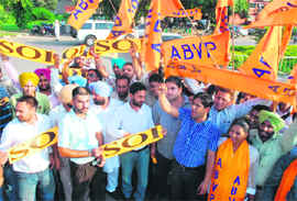 Members of the ABVP-SOI alliance raise slogans on PU campus in Chandigarh on Wednesday. 