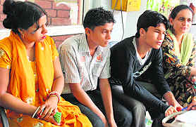 Missing schoolboys with their parents in Chandigarh on Wednesday. 