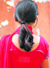 A student sports the sticker of a student organisation during campaigning on PU campus on Wednesday. 