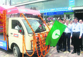 SBI DGM Maheep Kumar flags off a publicity van at the launch of the special home loan campaign in Dehradun.