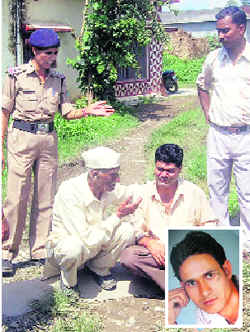 A policewoman and neighbours try to console the father of Sudhir Rawat (inset) who was found murdered in Umedpur on Wednesday.