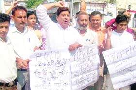 Activists of the Jammu West Assembly protest against the bad condition of roads in Jammu