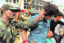 Security personnel take away protesters agitating against the lathicharge on AICC general secretary Digvijay Singh at Rajgarh, in Bhopal on Wednesday