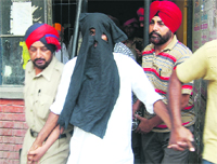 Alleged terrorist Balbir Singh Bhootna being taken out of a court in Ludhiana on Wednesday. 
