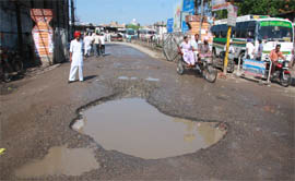A pithole at the entry point of the Bathinda bus stand. 
