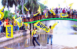 Supporters wave flags of their organisation ahead of the open house for student council elections on Panjab University campus in Chandigarh on Thursday.