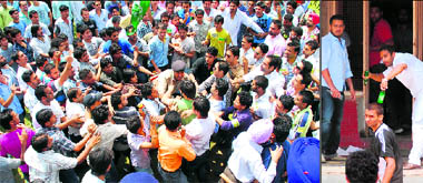 Smashed windowpanes of the library; a lone policeman tries to control the crowd; a student aims a bottle at rivals.