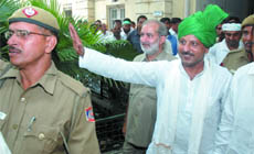 Kishan Pahelwan comes straight from Tihar Central Jail to take oath.