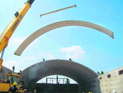 Engineers and workers of Proflex Systems fit self-supported steel roofing on a HWC godown in Fatehabad.