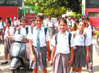 Students come out of a school in Jalandhar