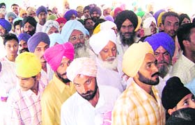 Devotees wait for their turn to pay obeisance at Guga Mari
