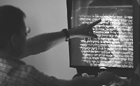 Uri Ehrlich, a liturgist at Ben-Gurion University, points to a passage of ancient text that a new computer programme can help decipher at his office in the southern city of Beersheba.