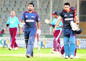 MS Dhoni and Manvinder Bisla (right) who scored centuries for Air India Blue in a match for the BCCI Sahara Corporate Trophy at Mohali