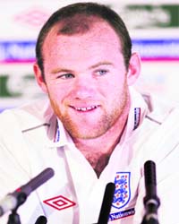Englands Wayne Rooney attends a media conference at the team hotel in Watford, north of London