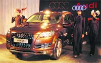 Models pose with Audi Q7 at its launch in Ludhiana